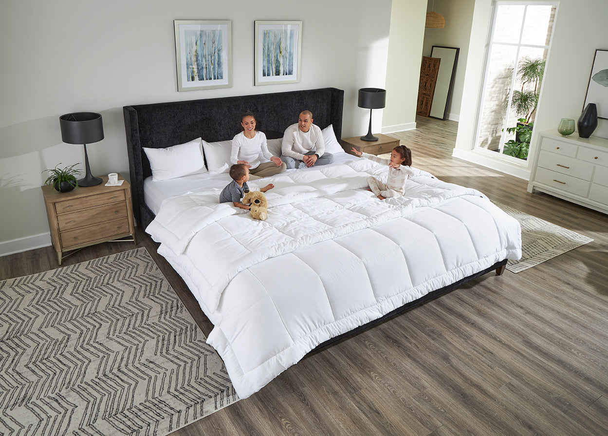 Family hanging out in bed