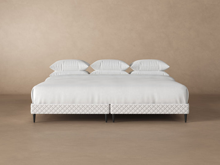 Front view of platform bed frame with a mattress