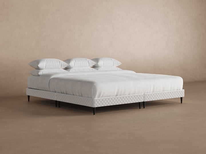 Angled view of platform bed frame with a mattress