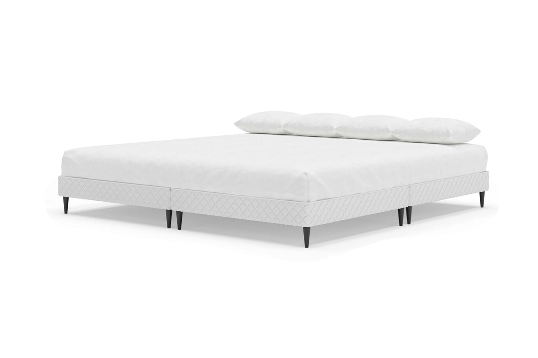 Angled view of platform bed frame with a mattress