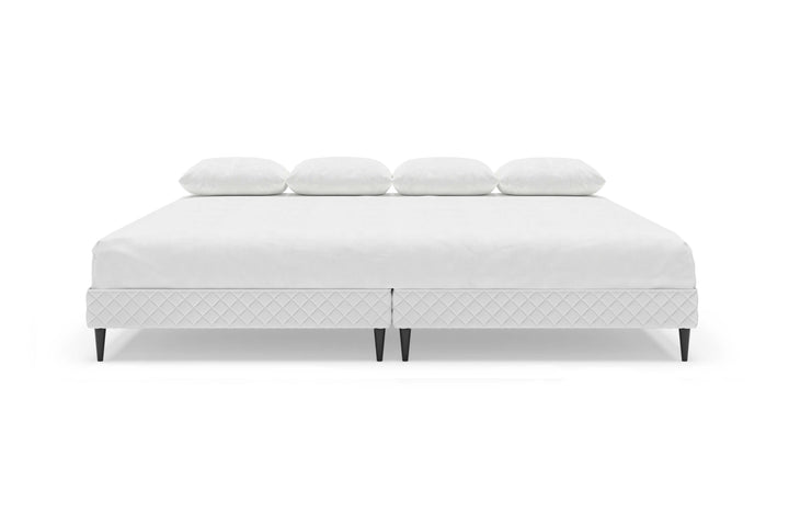 Front view of platform bed frame with a mattress
